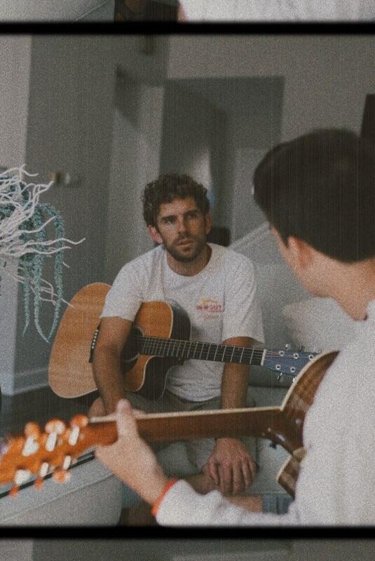 Michael Schirner and a student both holding guitars